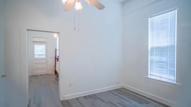 a view of walk in closet with empty racks