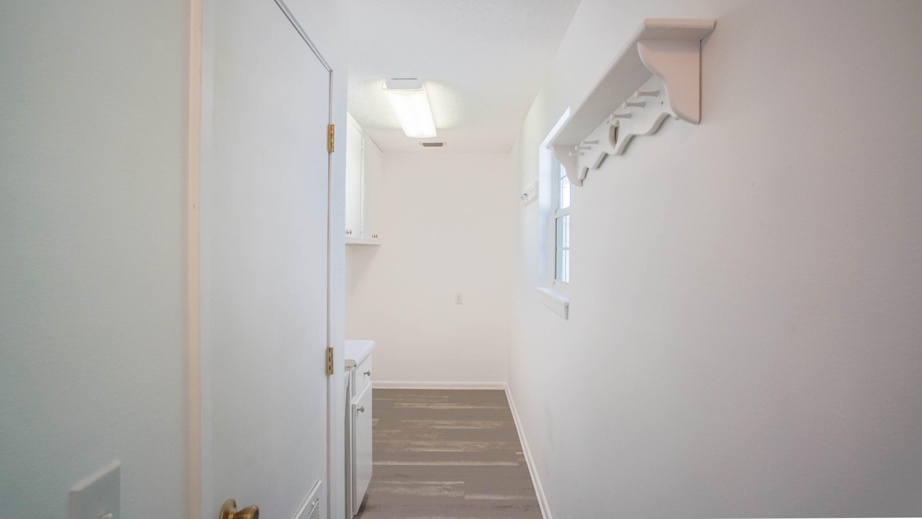 270 South 12th Street DeFuniak Springs, FL 32435 - Photo 45 of 57 a view of a hallway with wooden floor and entryway