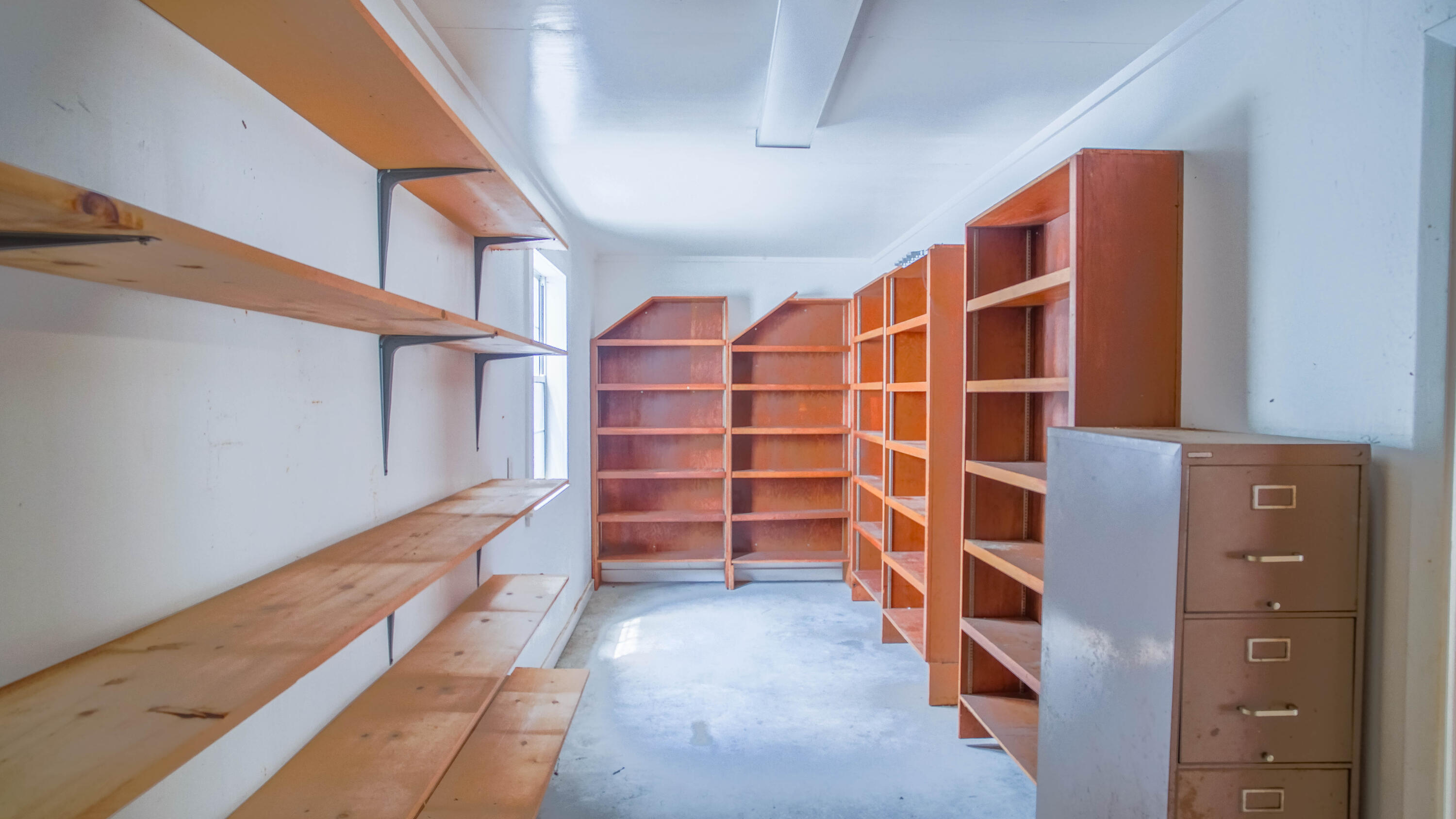 270 South 12th Street DeFuniak Springs, FL 32435 - Photo 50 of 57 a view of walk in closet with empty racks