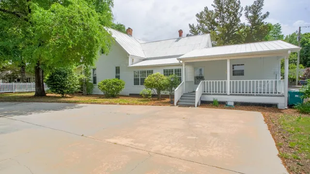 a house with trees in front of it