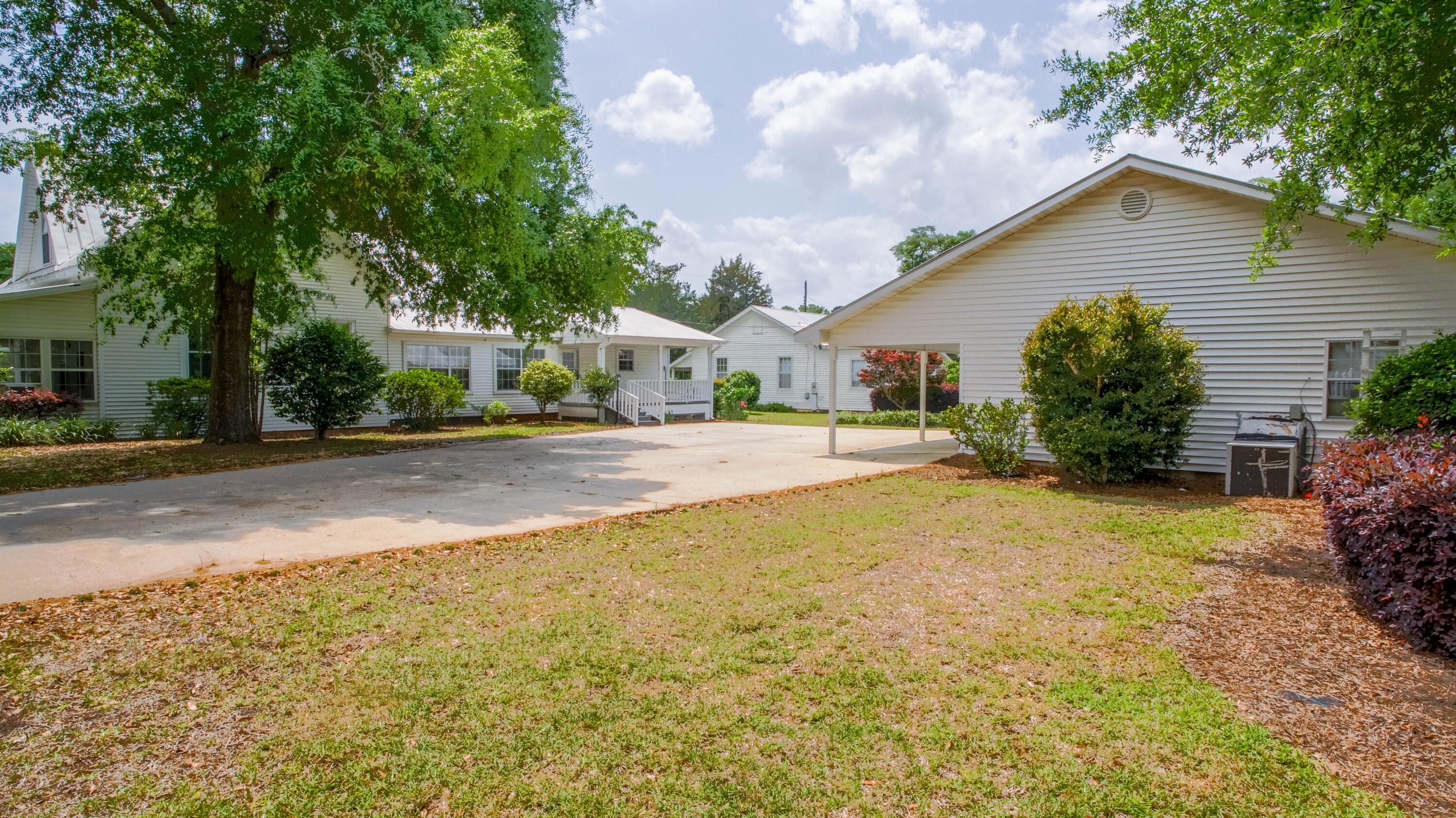 270 South 12th Street DeFuniak Springs, FL 32435 - Photo 10 of 57 a house with trees in front of it
