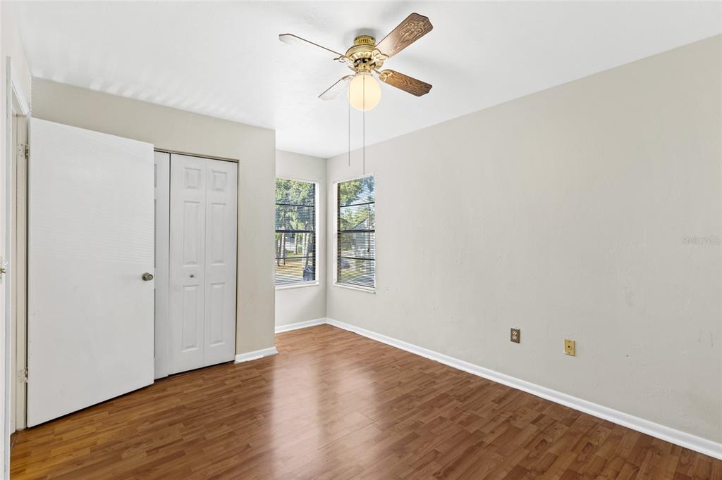4345 Southwest 20th Lane Gainesville, FL 32607 - Photo 12 of 17 wooden floor in an empty room with a window