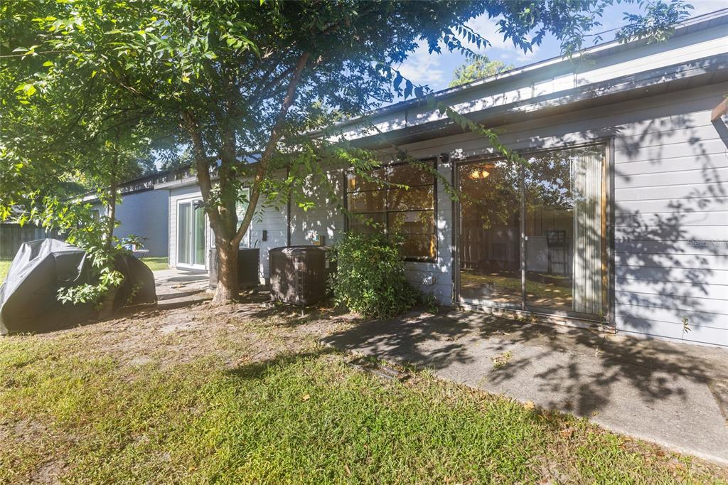 4345 Southwest 20th Lane Gainesville, FL 32607 - Photo 16 of 17 a view of a house with a yard