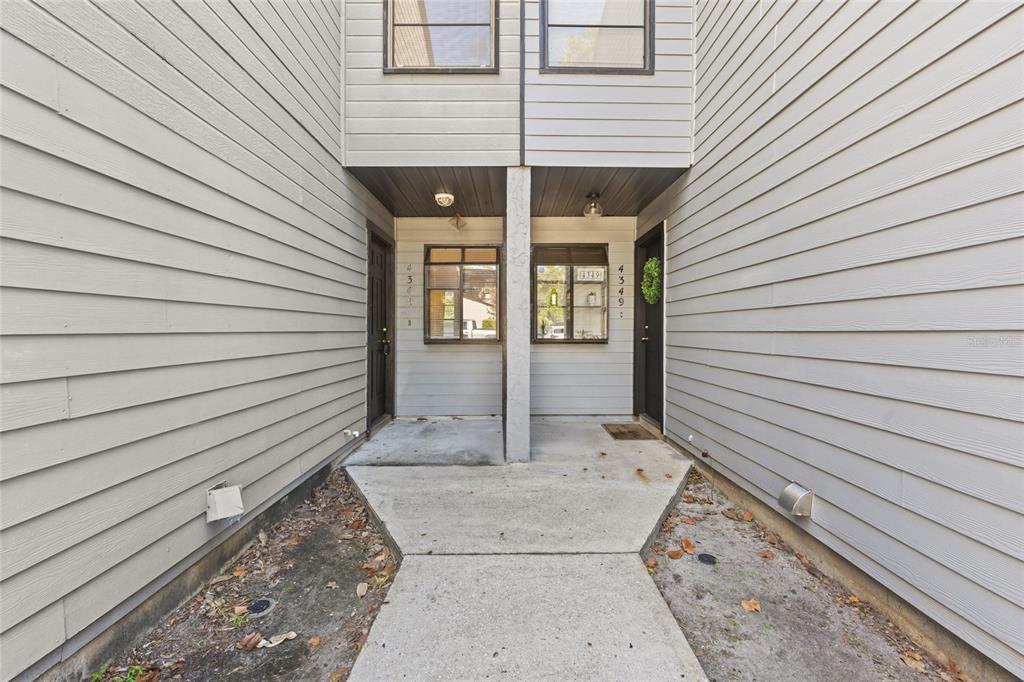 4345 Southwest 20th Lane Gainesville, FL 32607 - Photo 2 of 17 a view of a porch with a bench