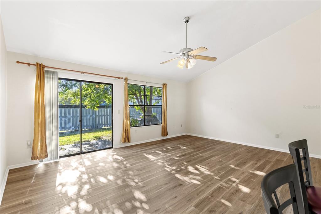 4345 Southwest 20th Lane Gainesville, FL 32607 - Photo 4 of 17 a view of a livingroom with a ceiling fan and window