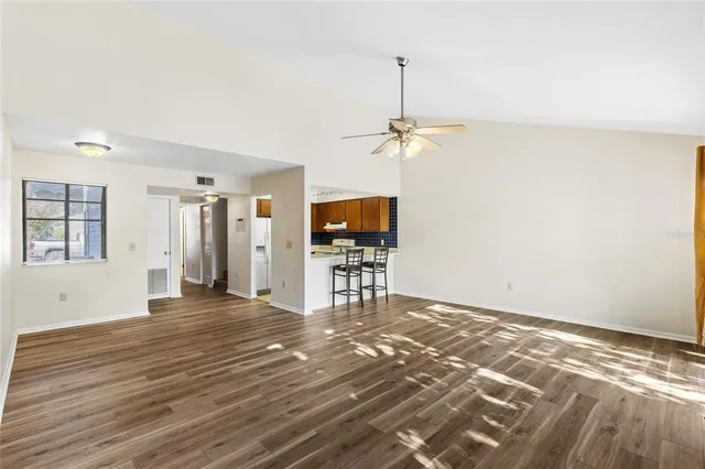 a view of empty room with a sink and chandelier