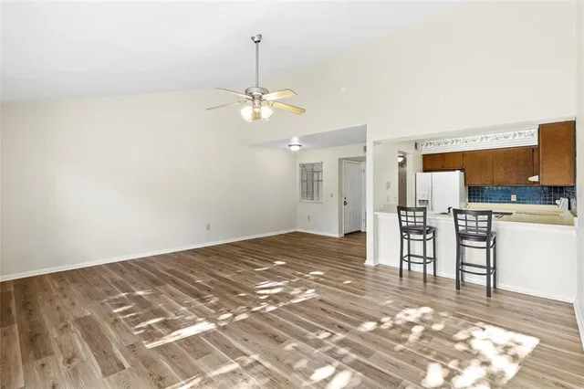 a view of a kitchen with a sink and microwave