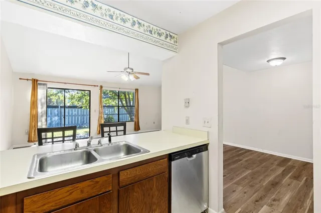 a kitchen with a sink and a window