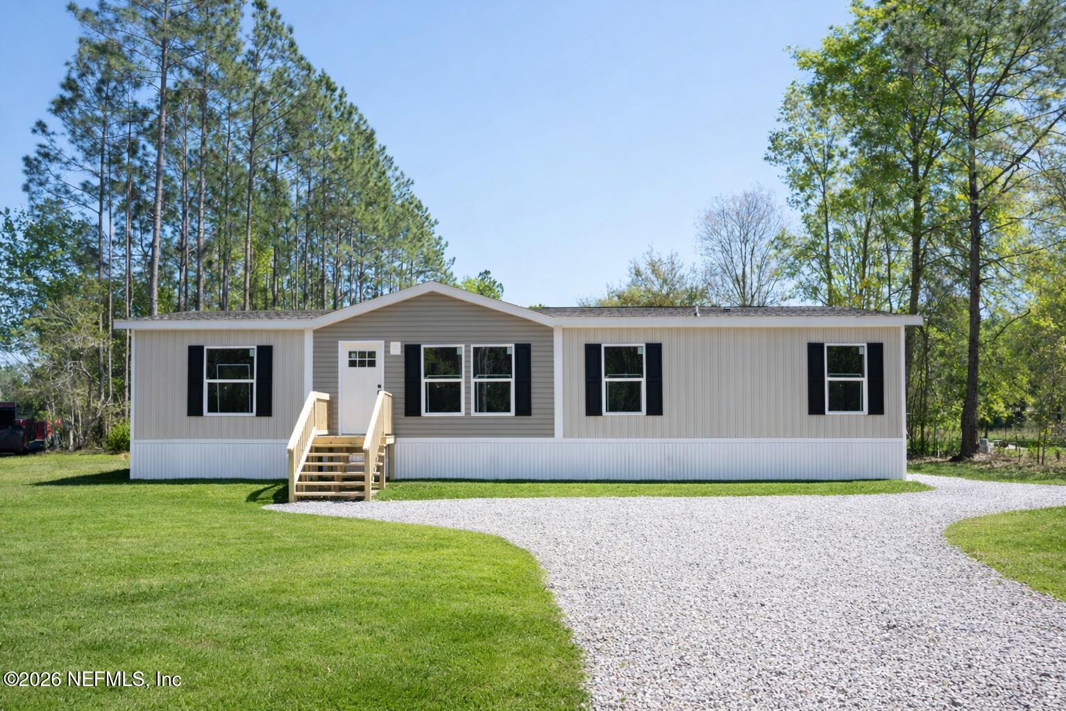 10101 Co Road Sanderson, FL 32087 - Photo 3 of 10 a front view of house with yard and green space