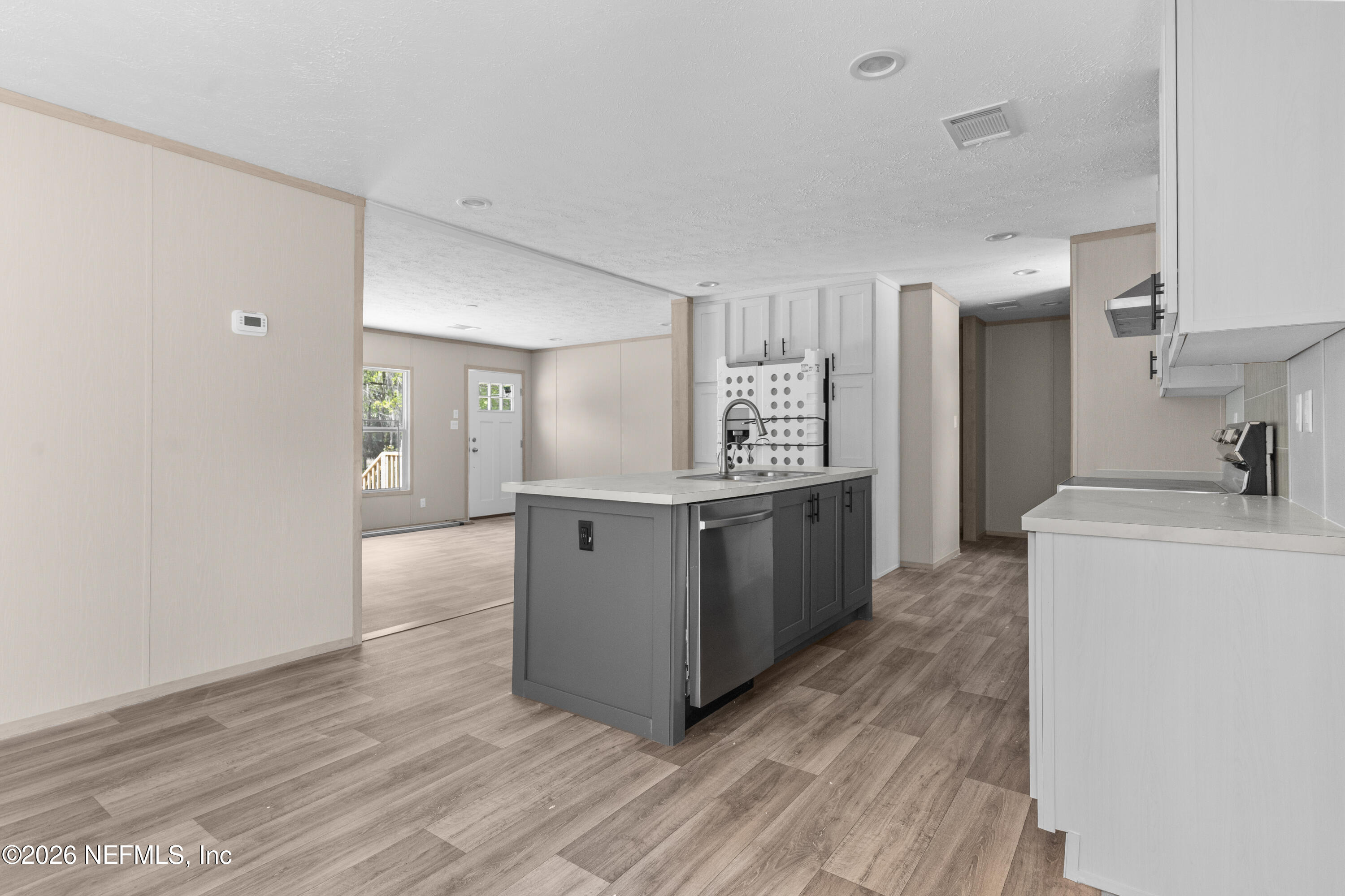 10101 Co Road Sanderson, FL 32087 - Photo 6 of 10 a kitchen with stainless steel appliances a refrigerator and a stove