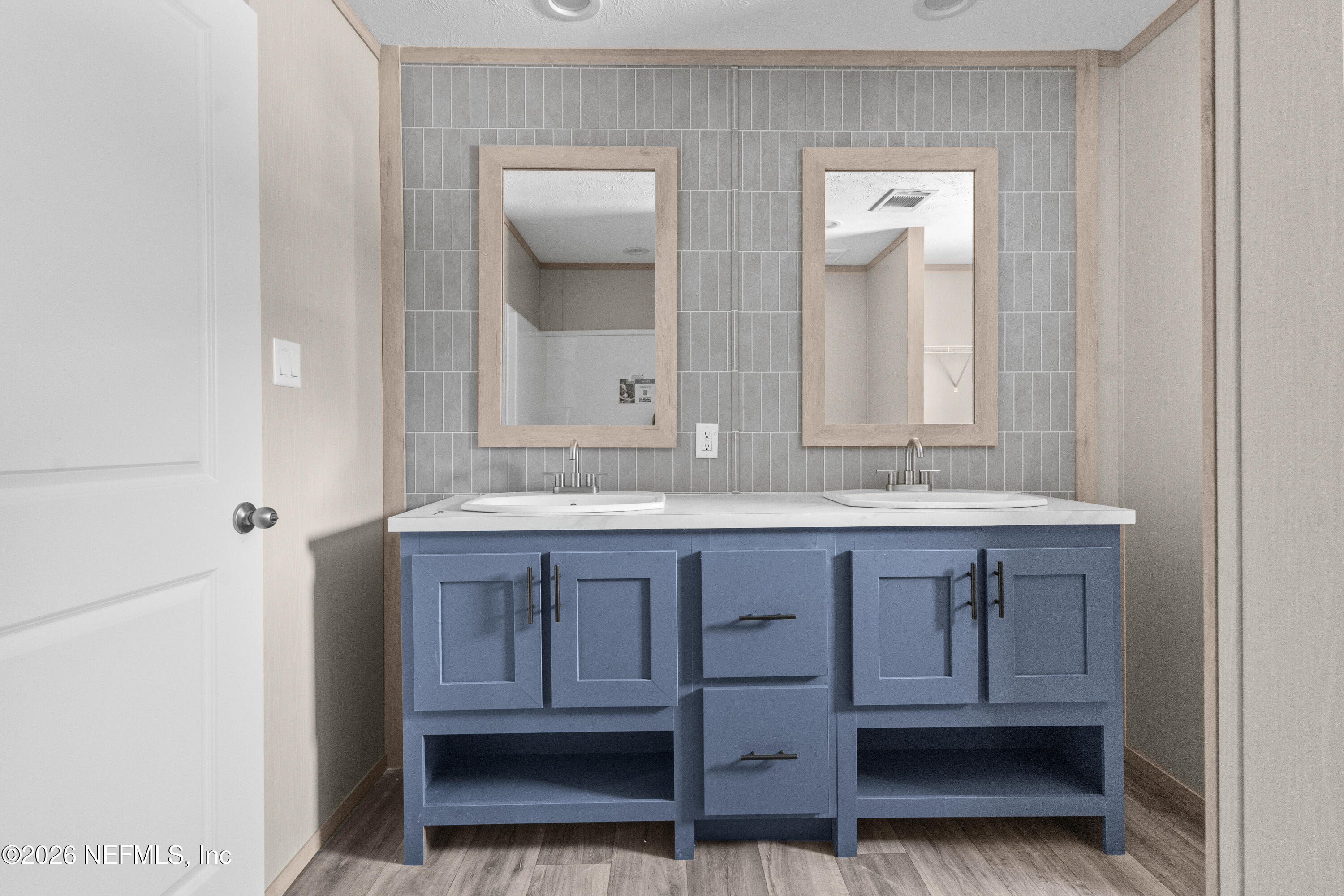 10101 Co Road Sanderson, FL 32087 - Photo 8 of 10 a bathroom with a sink and a mirror