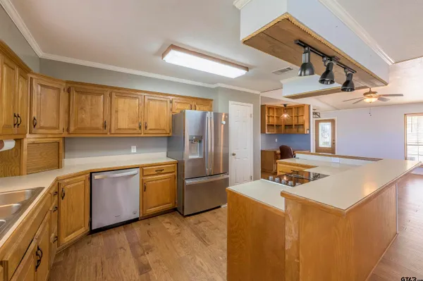 a kitchen with a sink stove and cabinets