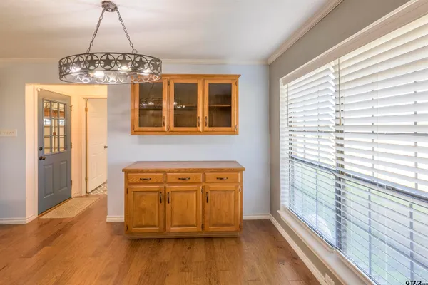 a view of a dining room with furniture and window