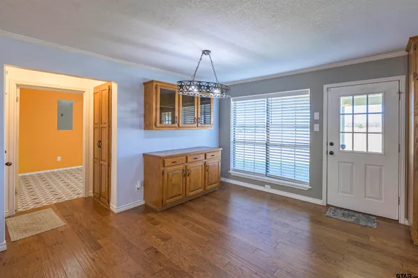 a view of a room with a table and chairs