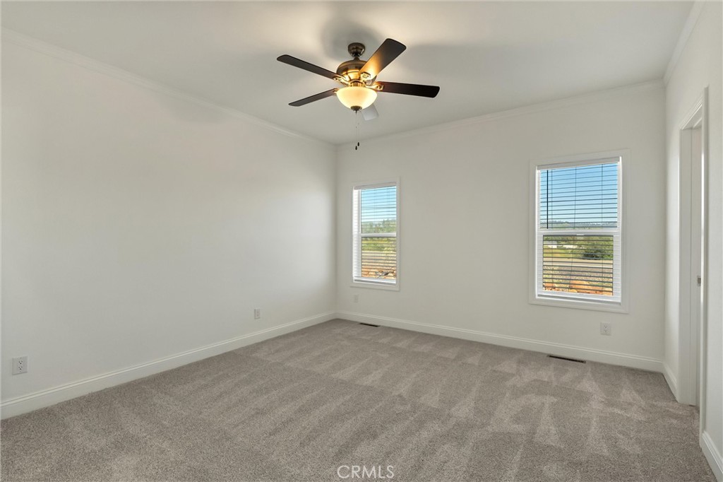 4333 Pentz Road, Unit 30 Paradise, CA 95969 - Photo 24 of 29 an empty room with ceiling fan and window
