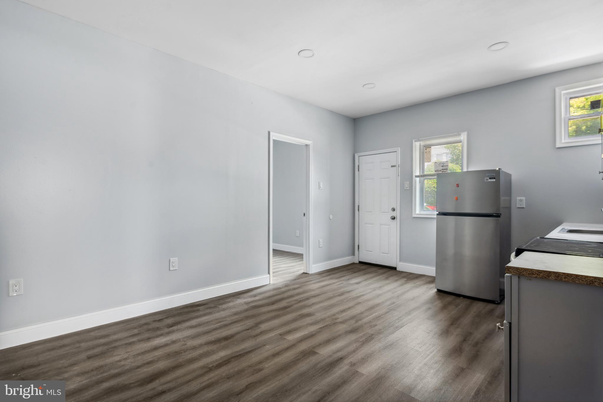 171 East Sharpnack Street Philadelphia, PA 19119 - Photo 5 of 15 a view of a kitchen with wooden floor and electronic appliances