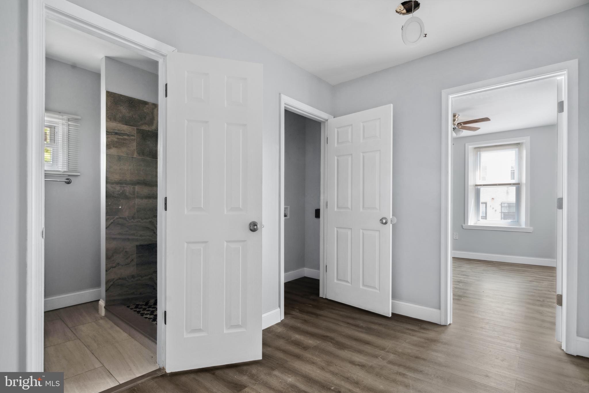 171 East Sharpnack Street Philadelphia, PA 19119 - Photo 6 of 15 an empty room with wooden floor & closet area