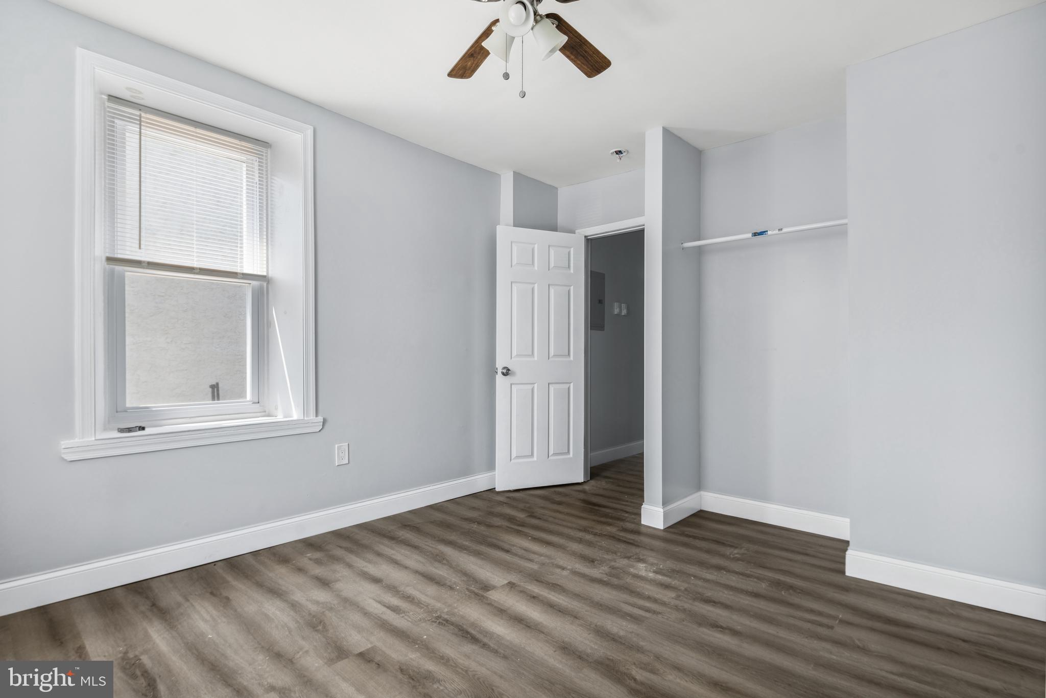 171 East Sharpnack Street Philadelphia, PA 19119 - Photo 10 of 15 an empty room with wooden floor cabinet and windows