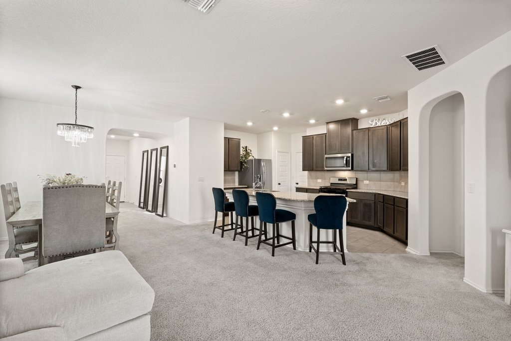 218 Summit Drive Lockhart, TX 78644 - Photo 15 of 38 a large kitchen with a table and chairs