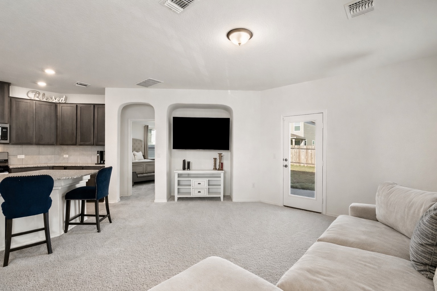 218 Summit Drive Lockhart, TX 78644 - Photo 16 of 38 a living room with furniture and a flat screen tv