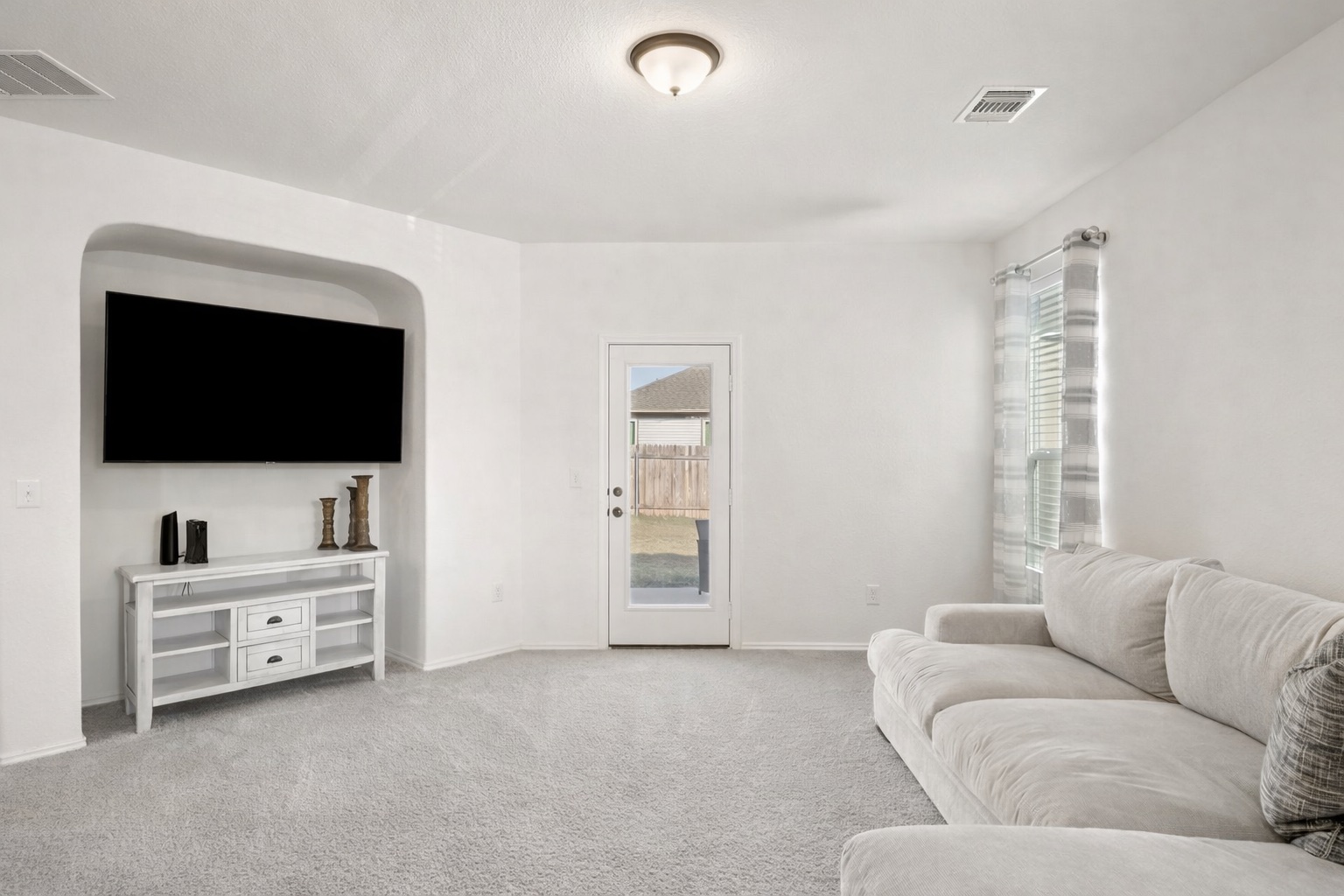 218 Summit Drive Lockhart, TX 78644 - Photo 17 of 38 a living room with furniture and a flat screen tv