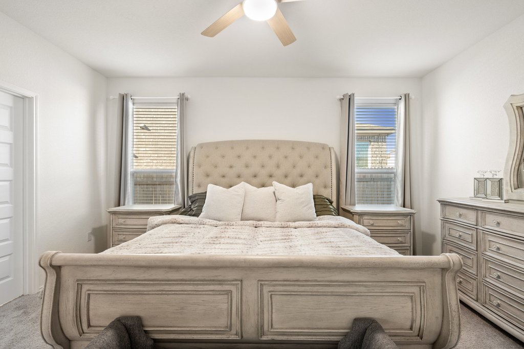 218 Summit Drive Lockhart, TX 78644 - Photo 21 of 38 a bedroom with a bed and a window