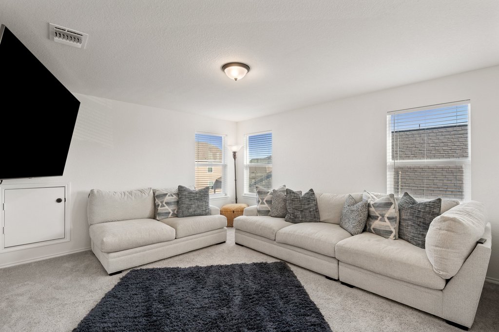 218 Summit Drive Lockhart, TX 78644 - Photo 25 of 38 a living room with furniture and a flat screen tv