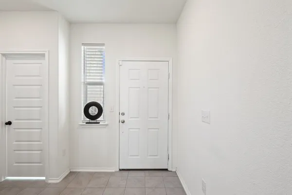 a view of front door and utility room