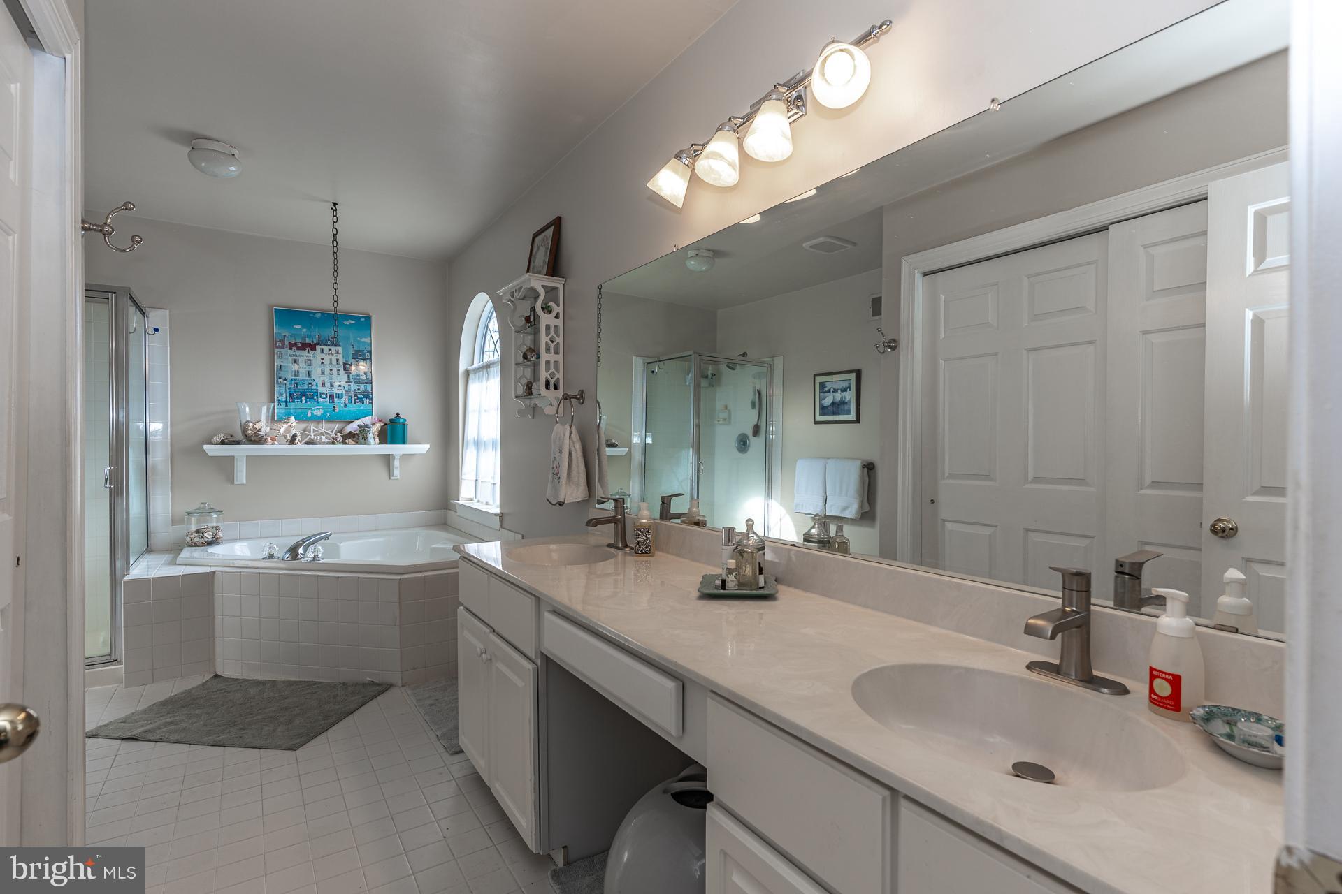 820 Waverly Road Kennett Square, PA 19348 - Photo 26 of 46 a bathroom with a granite countertop sink double vanity and a mirror