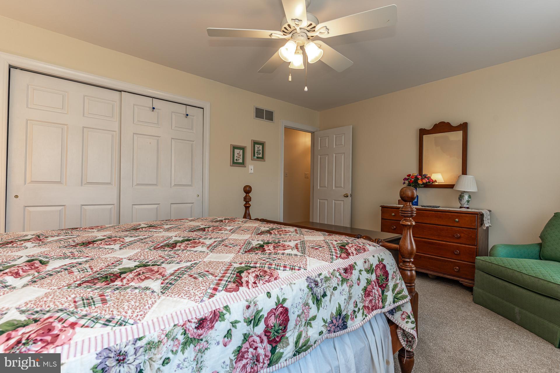 820 Waverly Road Kennett Square, PA 19348 - Photo 30 of 46 a bedroom with a bed and a chandelier