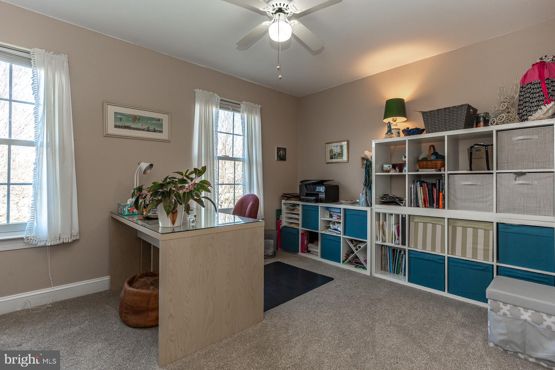 820 Waverly Road Kennett Square, PA 19348 - Photo 31 of 46 a living room with furniture and a book shelf