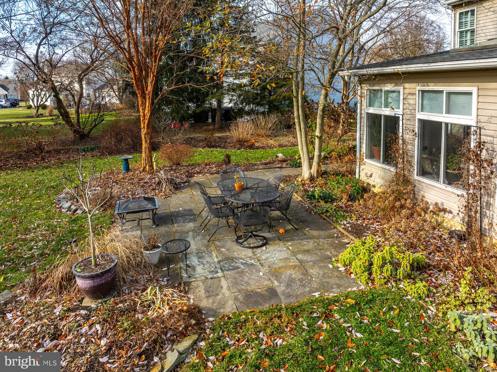 820 Waverly Road Kennett Square, PA 19348 - Photo 5 of 46 a view of a backyard with table and chairs and potted plants