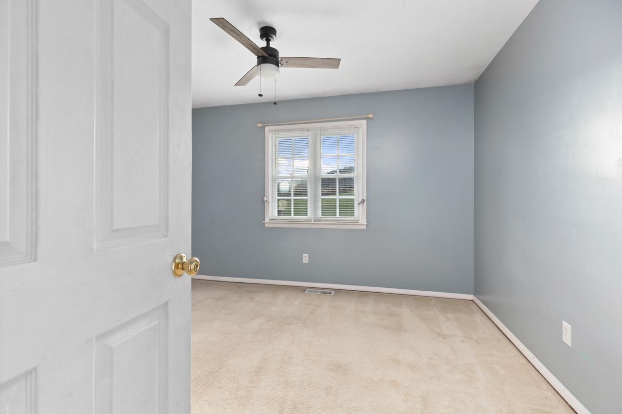 1052 Dutch Hollow Road Raphine, VA 24472 - Photo 15 of 46 an empty room with windows and cabinet