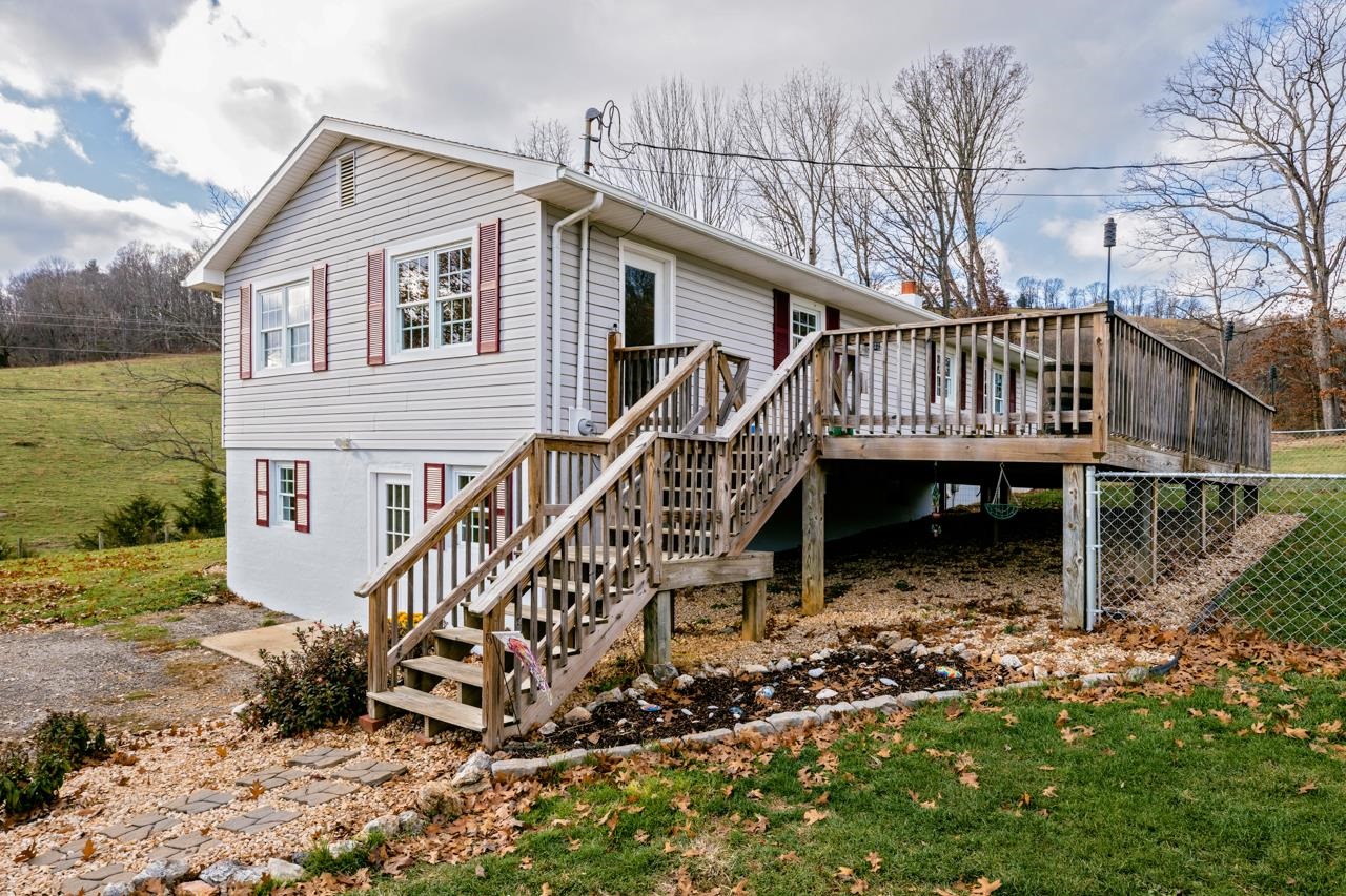 1052 Dutch Hollow Road Raphine, VA 24472 - Photo 31 of 46 a view of a house with wooden deck front of house