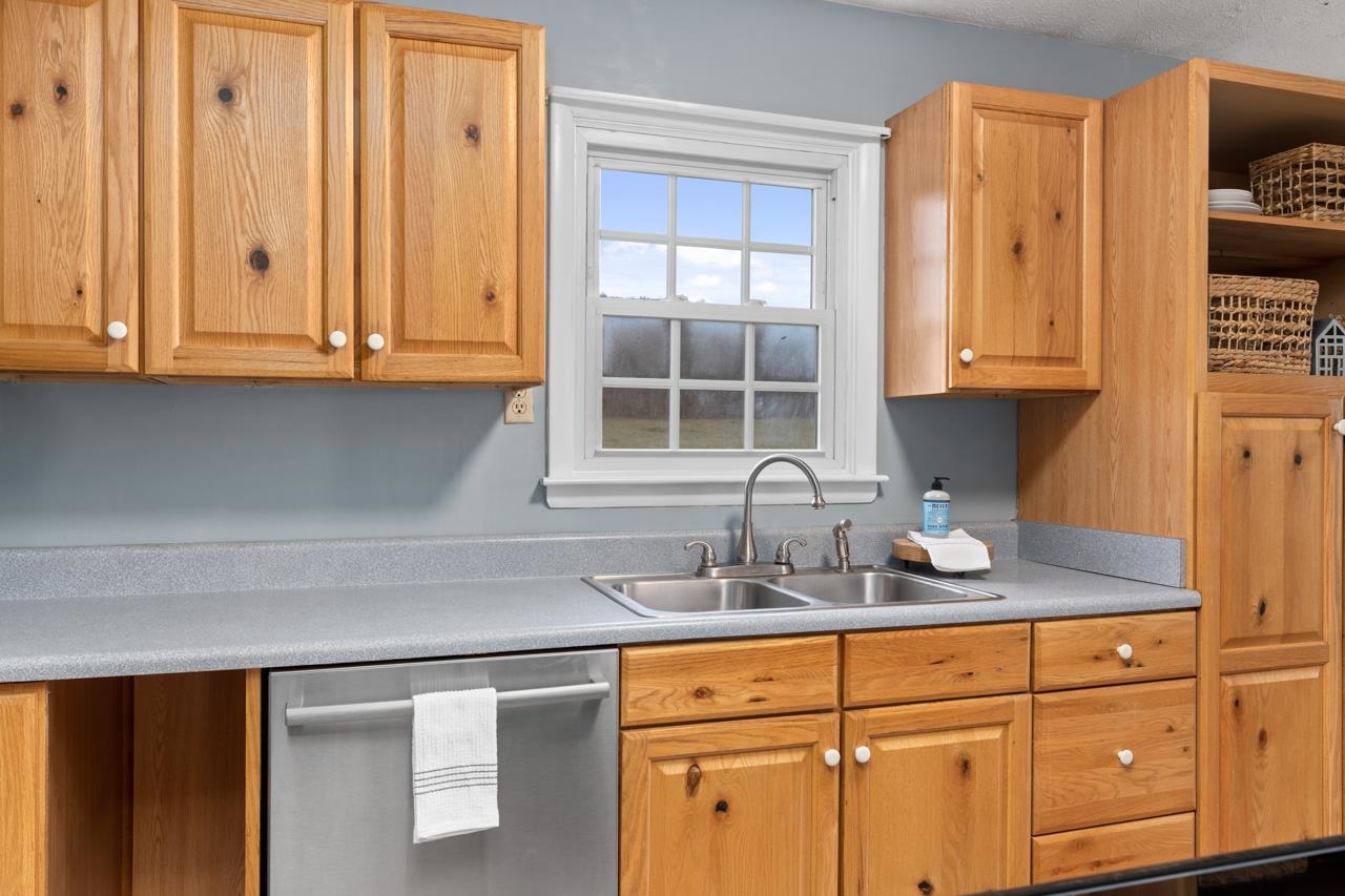 1052 Dutch Hollow Road Raphine, VA 24472 - Photo 4 of 46 a kitchen with granite countertop cabinets and window