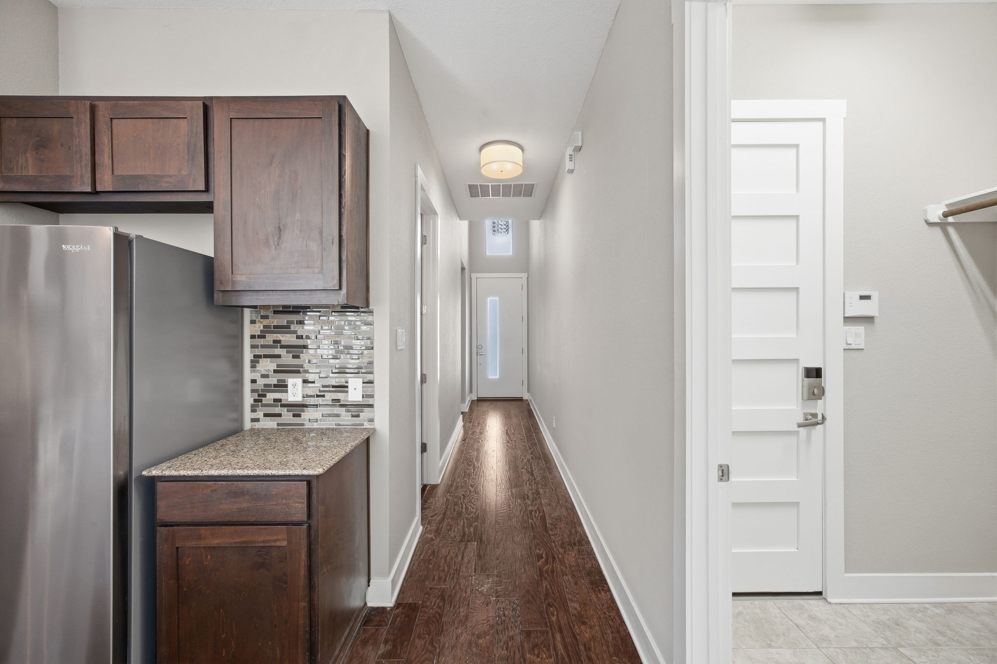 3521 Marcae Court Austin, TX 78704 - Photo 15 of 37 Corridor featuring baseboards and dark wood-style floors