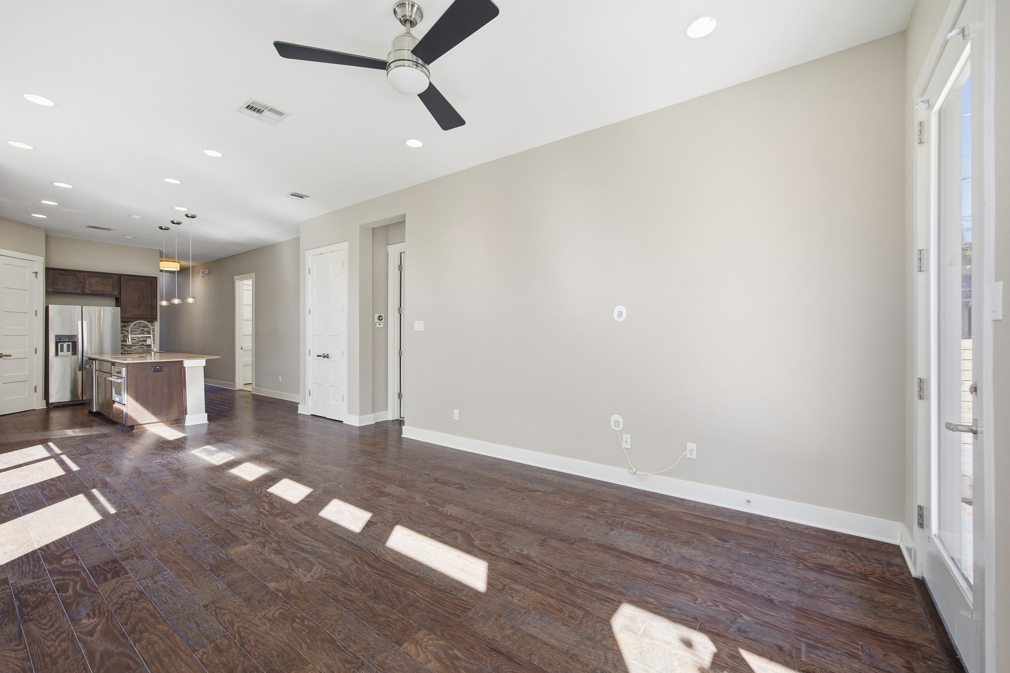 3521 Marcae Court Austin, TX 78704 - Photo 18 of 37 Unfurnished living room featuring dark wood-style flooring, recessed lighting, and ceiling fan
