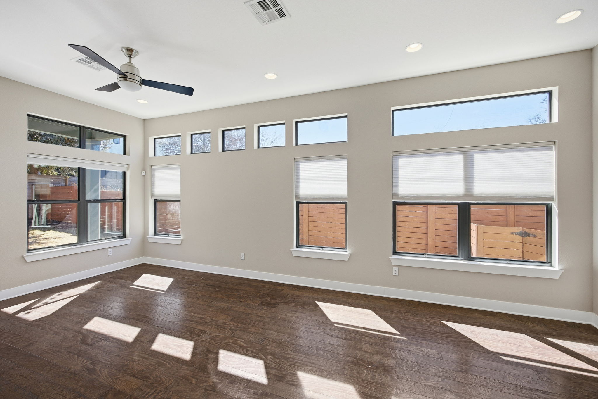 3521 Marcae Court Austin, TX 78704 - Photo 19 of 37 Unfurnished room with dark wood finished floors, a ceiling fan, and recessed lighting