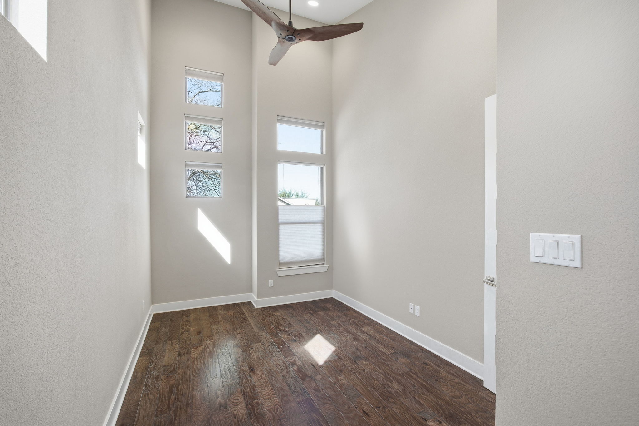 3521 Marcae Court Austin, TX 78704 - Photo 22 of 37 Foyer entrance with a high ceiling, dark wood finished floors, and ceiling fan