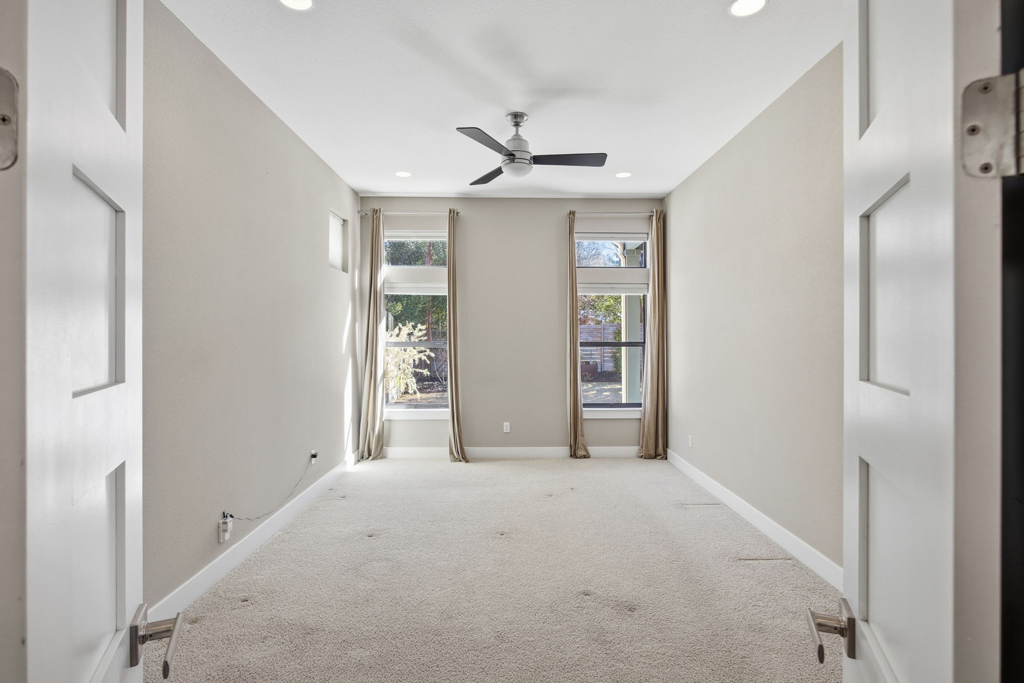 3521 Marcae Court Austin, TX 78704 - Photo 28 of 37 Unfurnished room with carpet floors, ceiling fan, and recessed lighting