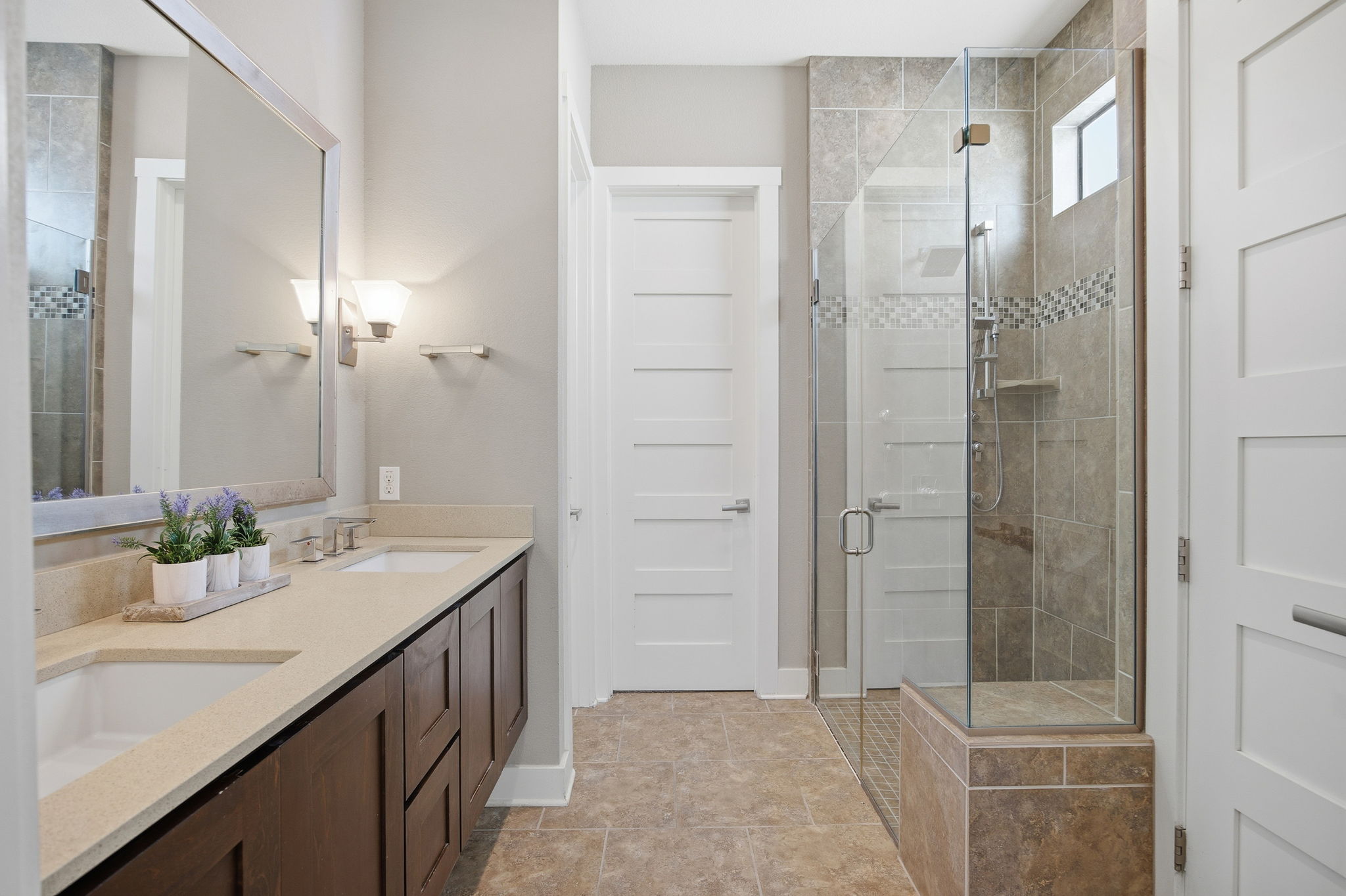 3521 Marcae Court Austin, TX 78704 - Photo 29 of 37 Bathroom with a shower stall and double vanity