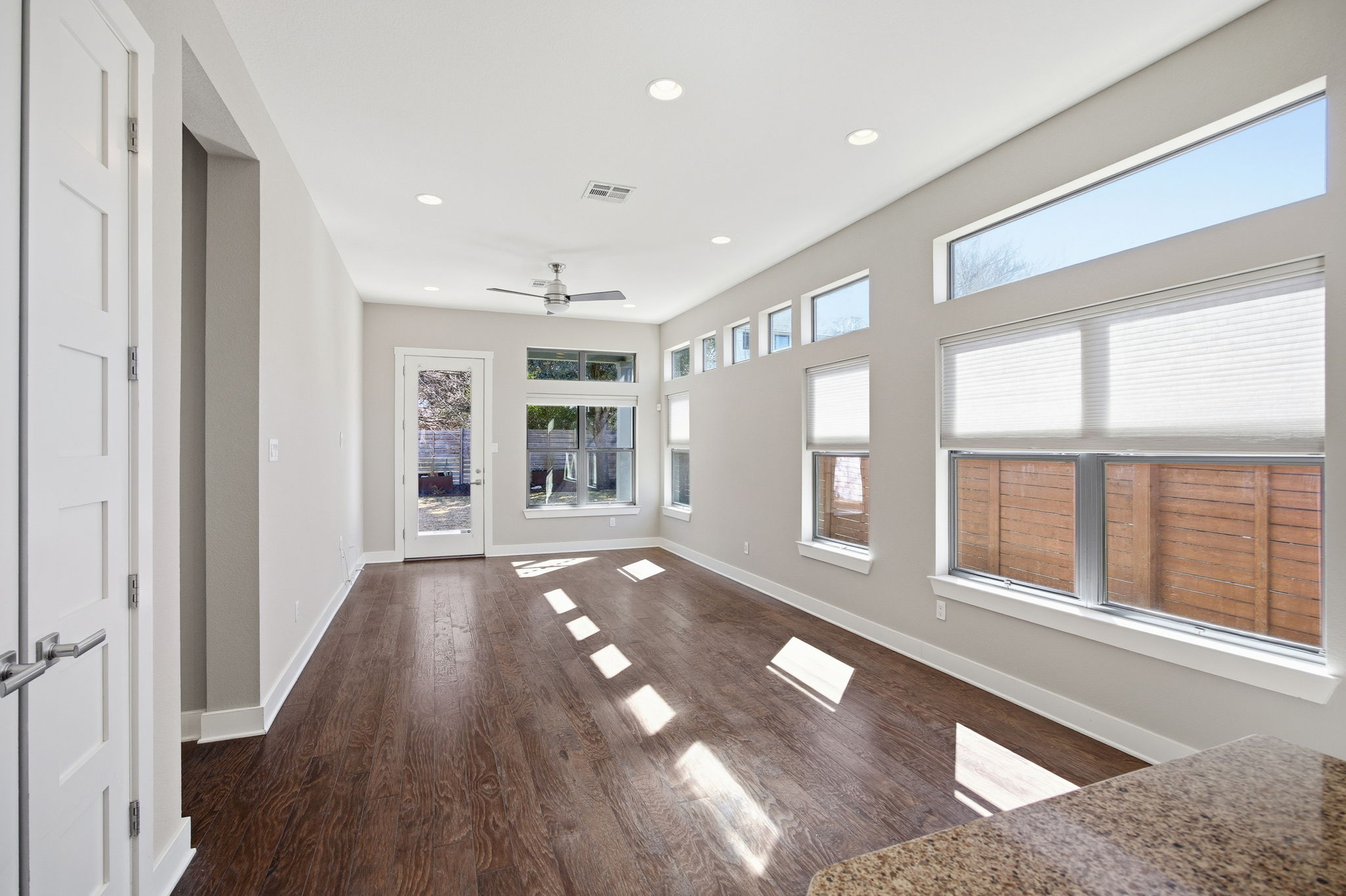 3521 Marcae Court Austin, TX 78704 - Photo 6 of 37 Unfurnished living room featuring dark wood-style flooring, recessed lighting, and ceiling fan