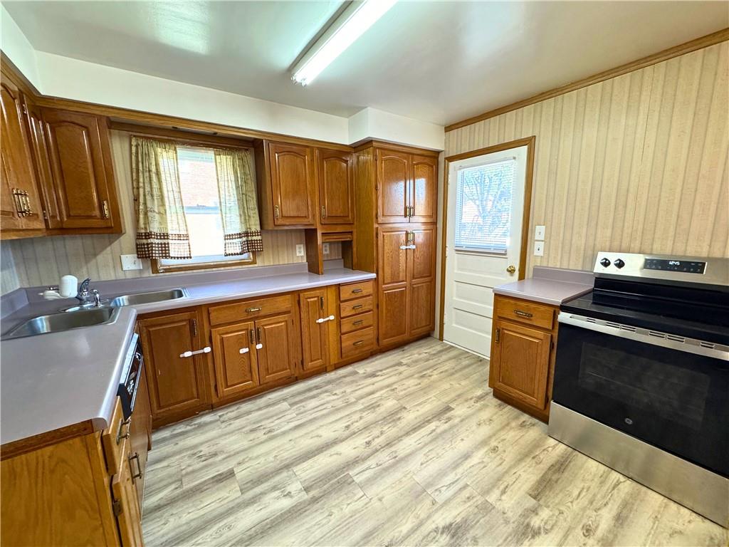 511 Ridgeway Avenue Grove City, PA 16127 - Photo 13 of 18 a kitchen with stainless steel appliances granite countertop a sink stove and refrigerator