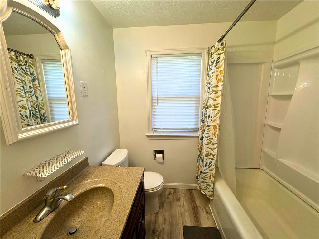 511 Ridgeway Avenue Grove City, PA 16127 - Photo 18 of 18 a bathroom with a granite countertop sink mirror vanity and a bathtub