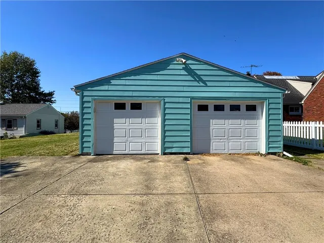 a front view of a house with a garage