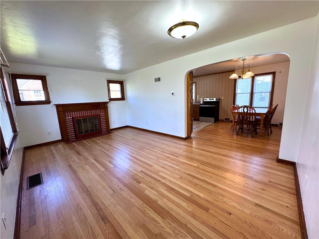 511 Ridgeway Avenue Grove City, PA 16127 - Photo 5 of 18 an empty room with wooden floor and furniture
