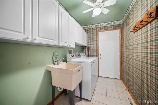 a kitchen with a sink cabinets and window