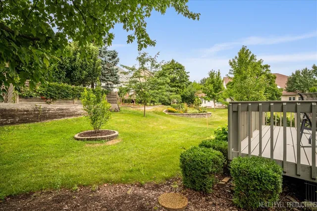 a view of a chairs and table on the deck