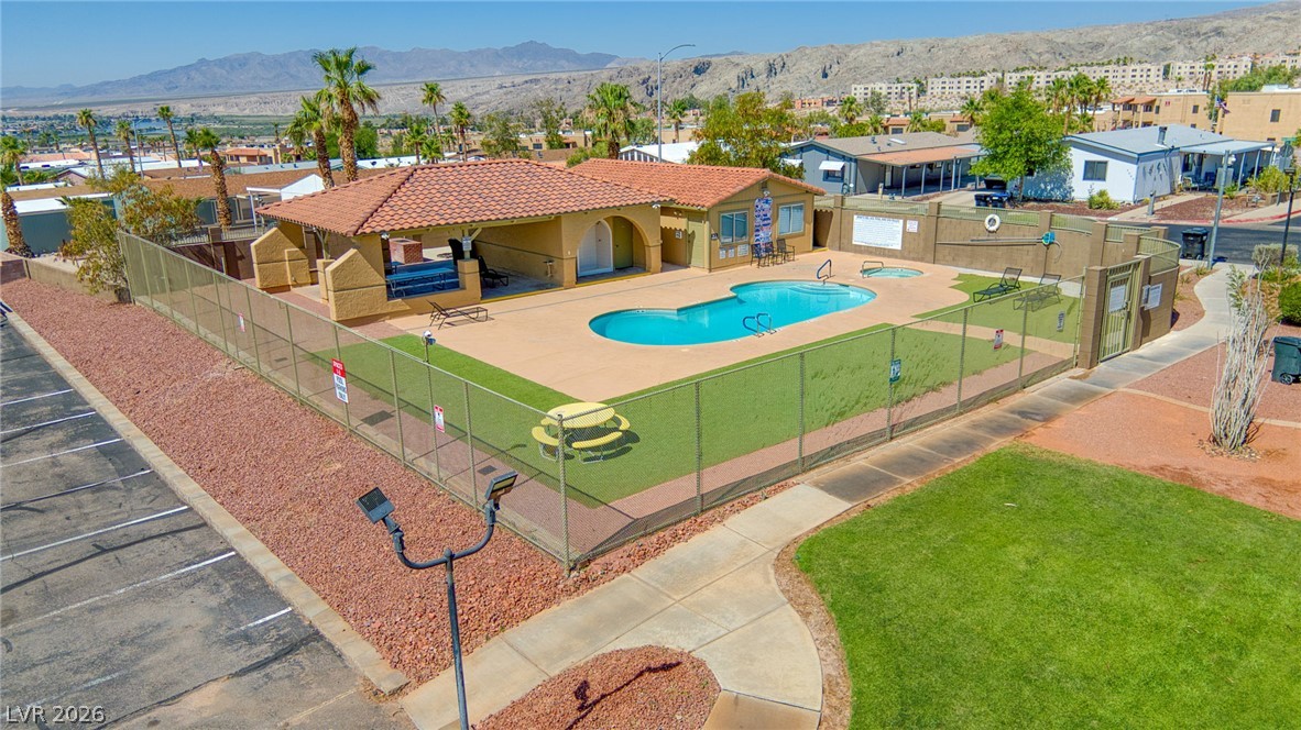 3189 Del Monte Street Laughlin, NV 89029 - Photo 26 of 32 A refreshing pool area, perfect for community gatherings, complements this desert landscape with mountain views.