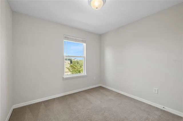 a view of a living room and a floor to ceiling window
